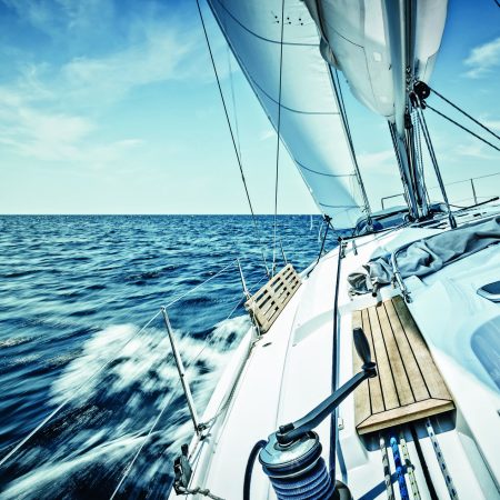 Sailing with sailboat. Long exposure.